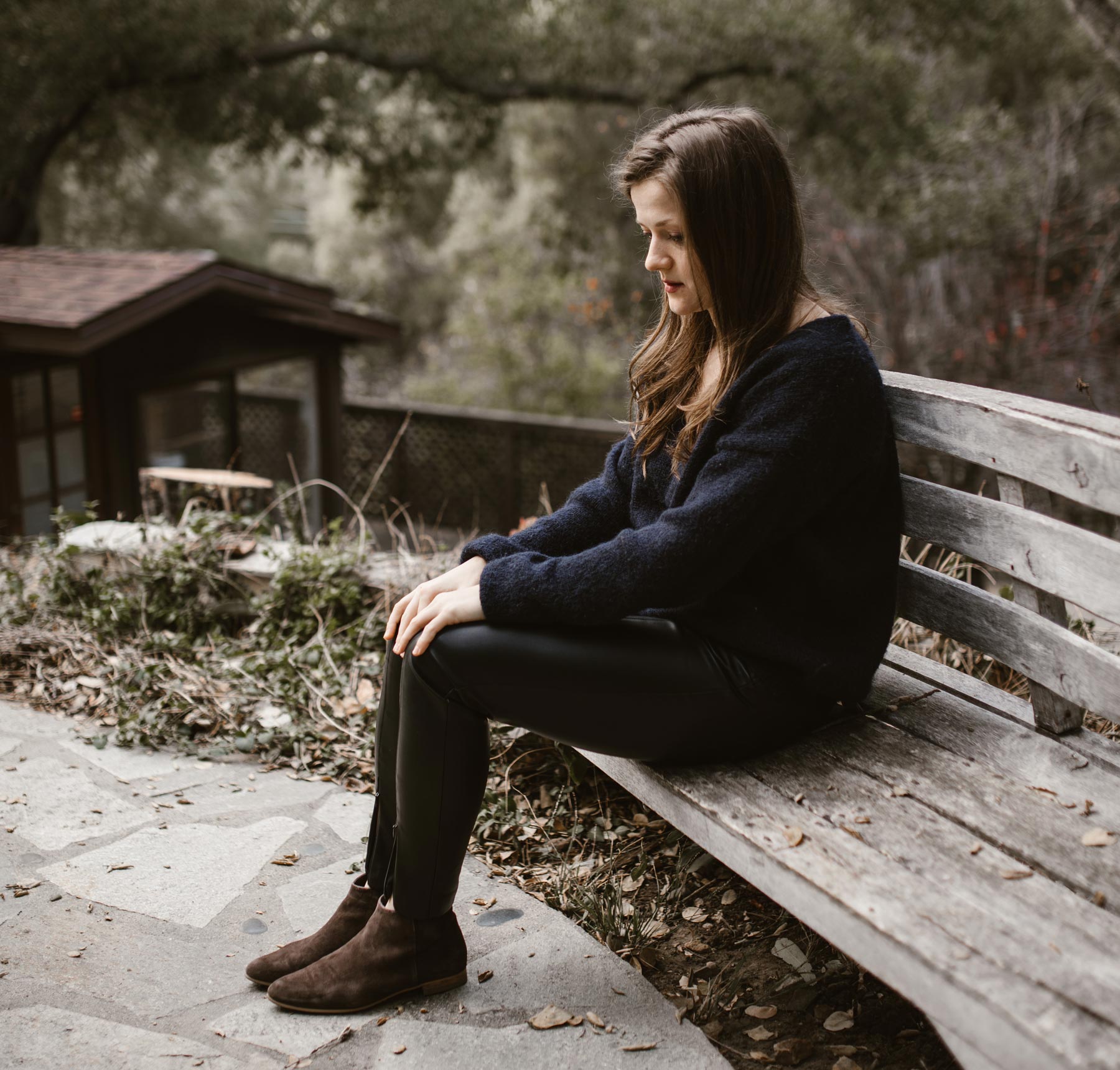 woman sitting alone on a bench