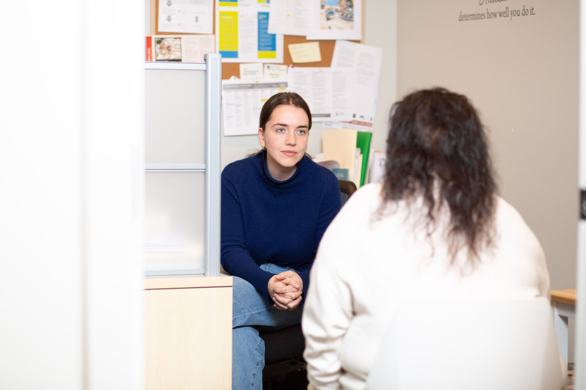 Female counselling talking to client